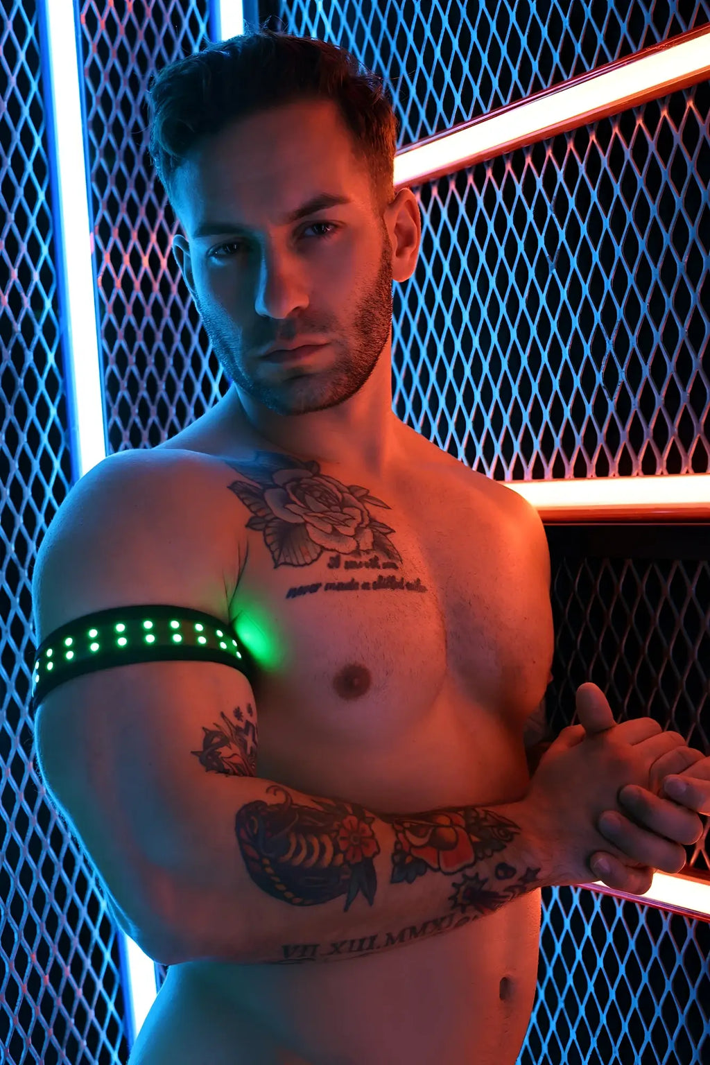 A sleek black Soundwave armband with a row of glowing green LED lights for wearable tech use