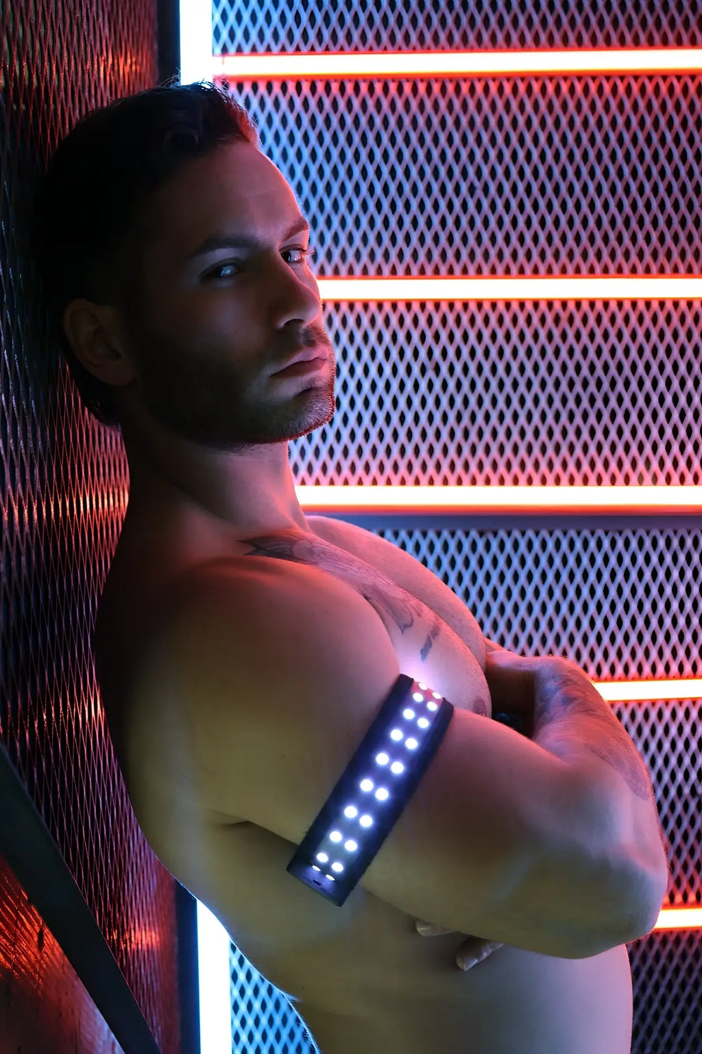 A sleek black led soundwave armband with bright white lights for fitness and outdoor use