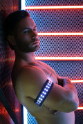 A sleek black led soundwave armband with bright white lights for fitness and outdoor use