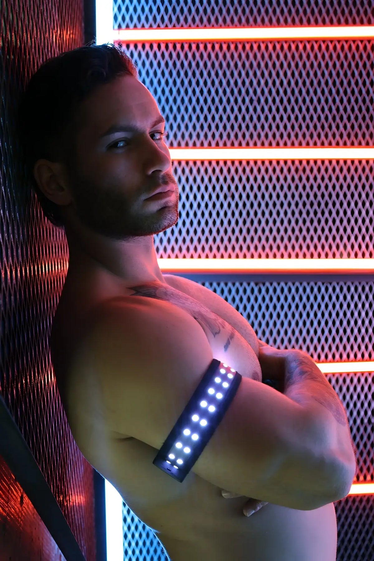 A sleek black led soundwave armband with bright white lights for fitness and outdoor use