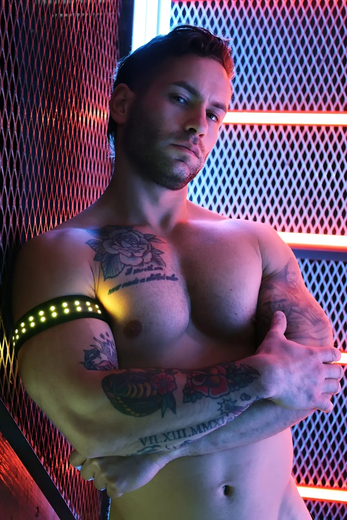 A sleek black soundwave armband with glowing yellow LED lights encircling the upper arm for active use