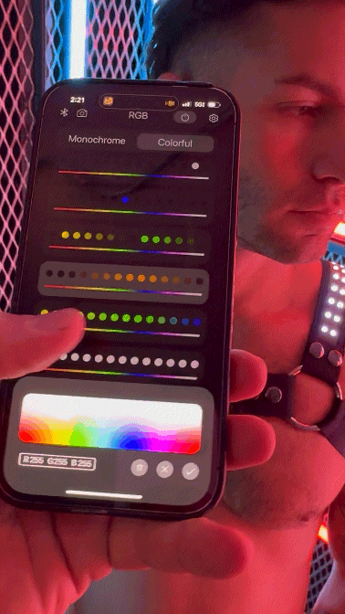 A black smartphone displaying a colorful rgb color picker interface for customizing the soundwave bulldog harness