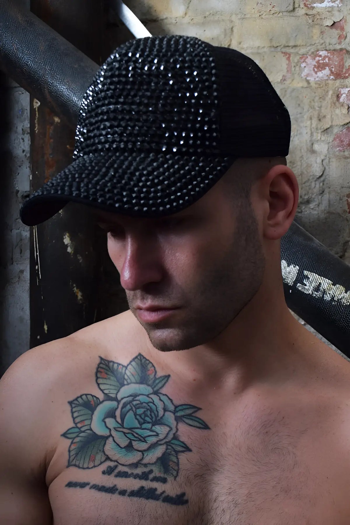 Black spark trucker hat with dense sparkling rhinestone pattern on the front panel for stylish wear