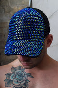 A dazzling blue rhinestone baseball cap with black mesh back and brim called spark trucker hat blue
