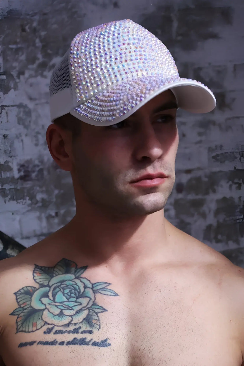 A shimmering white spark trucker hat adorned with sparkling rhinestones on the front panel and brim unicorn design