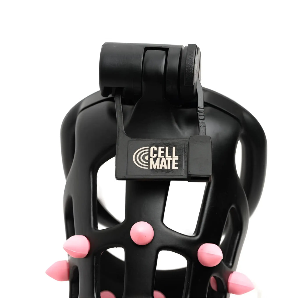 Black plastic Sport Fucker FlexiSpike size 2 cock cage with pink spiked protrusions and Cell Mate label visible