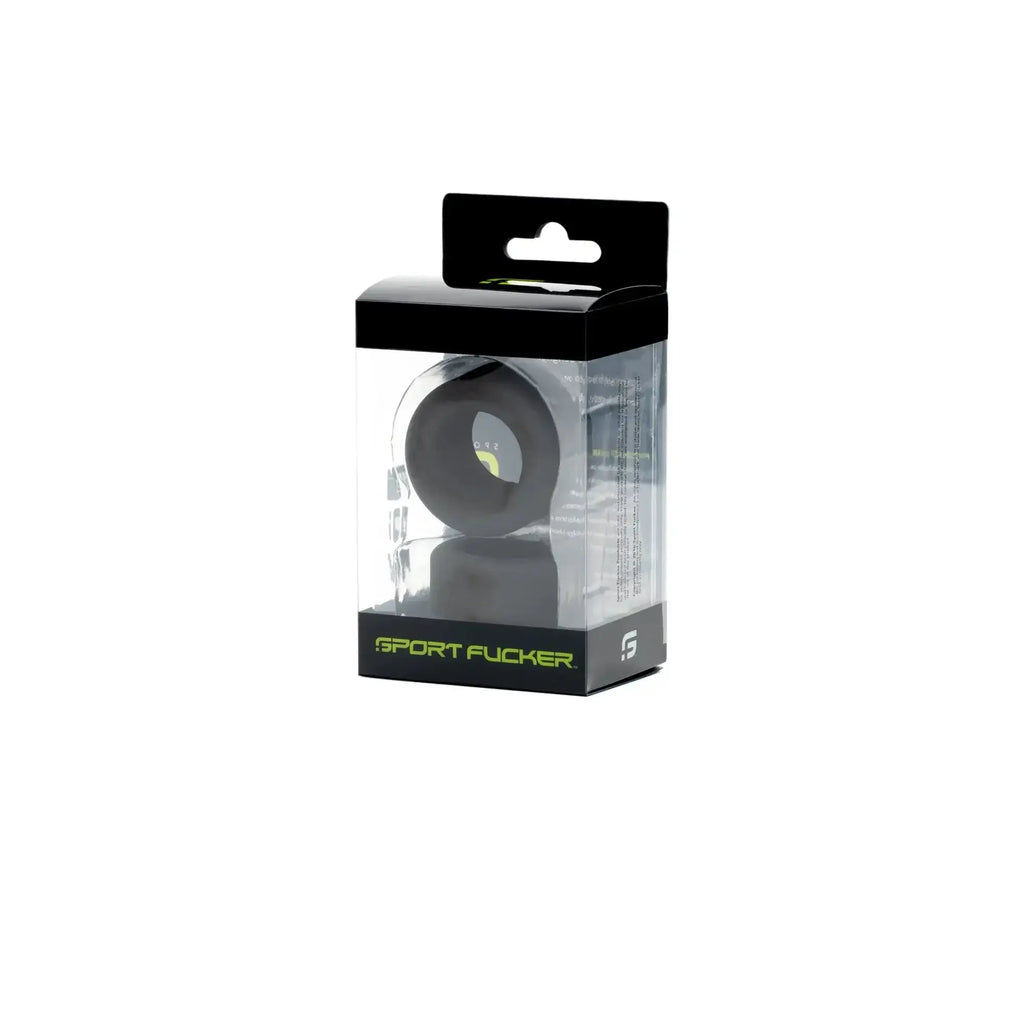 Black silicone Sport Fucker ring in clear packaging with black and neon green branding from Sport Fucker Nutt Job Set