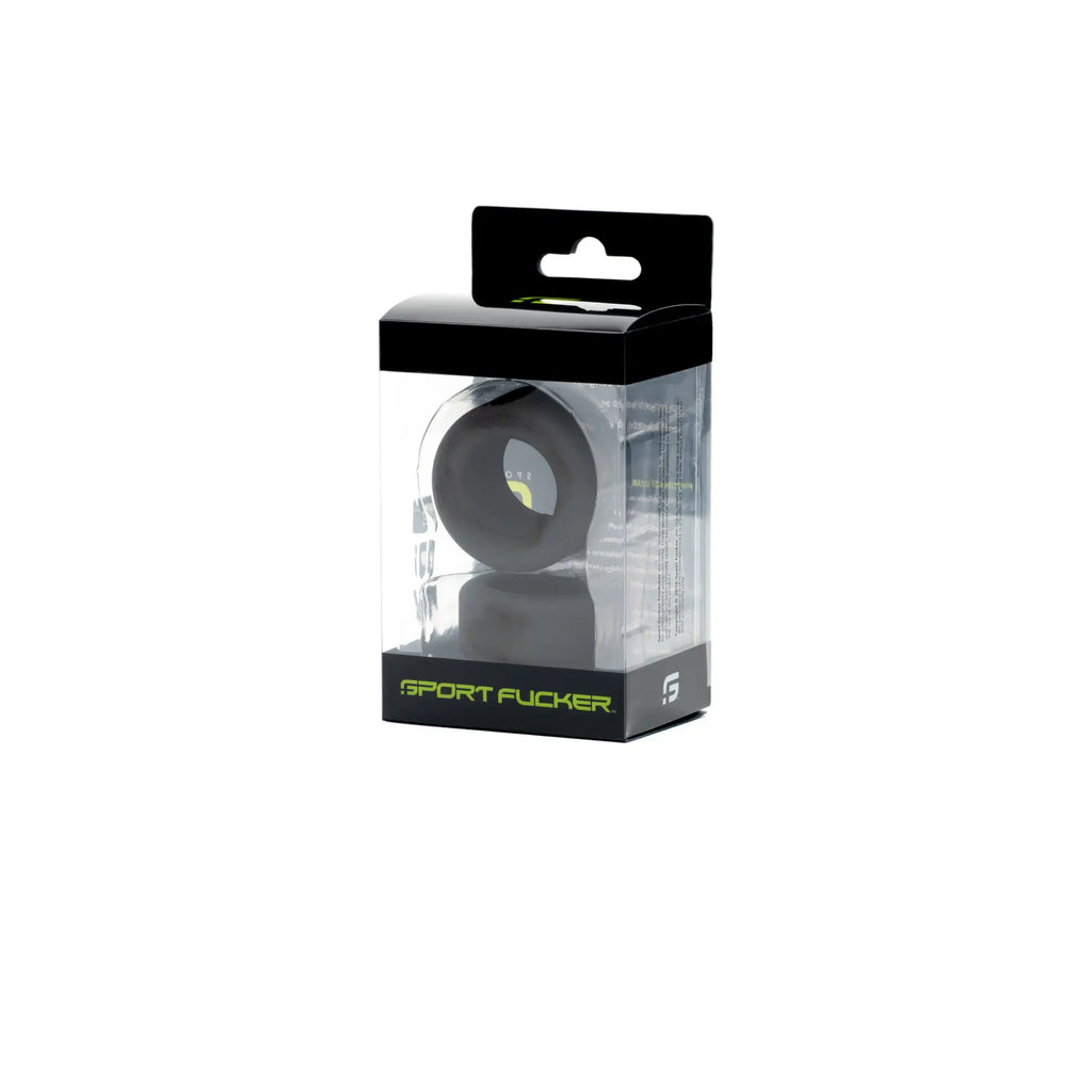 Black silicone Sport Fucker ring in clear packaging with black and neon green branding from Sport Fucker Nutt Job Set