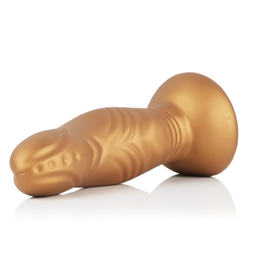 Gold-colored silicone anal plug with textured ridges and rounded base from Sport Fucker Pupa Liquid Silicone Dildo Small