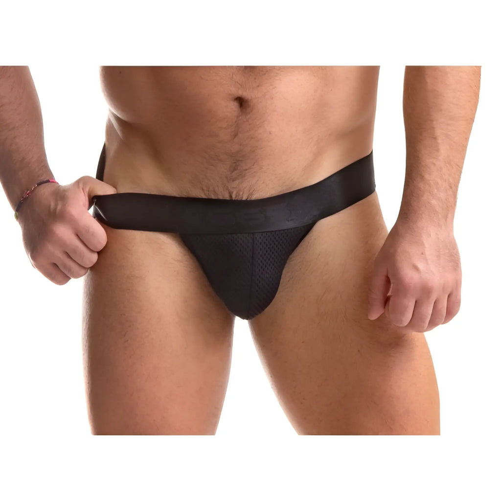 Black mesh sport fucker stealth jock strap with smooth elastic waistband in size large shown from the back side