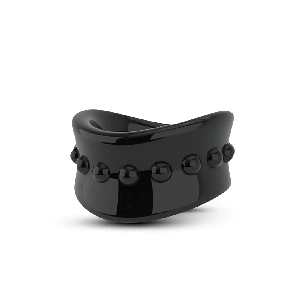 Black glossy ceramic stay hard beef ball stretcher with curved wide band and spaced spherical beads for snug fit