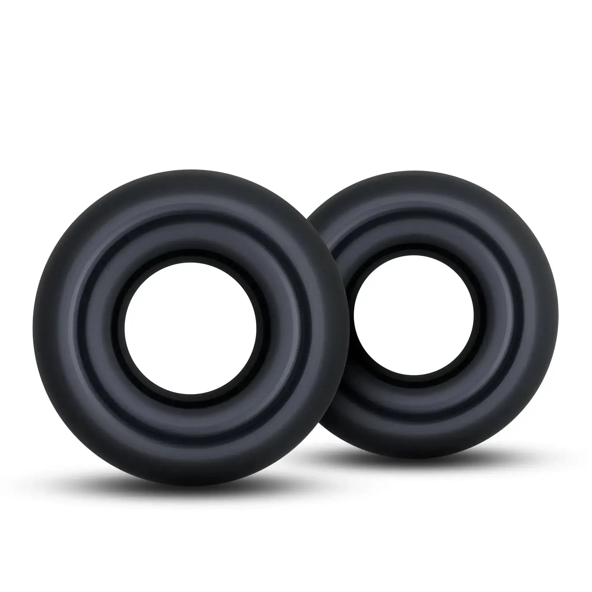 Black silicone stay hard donut rings oversized with concentric circular ridges for grip and comfort