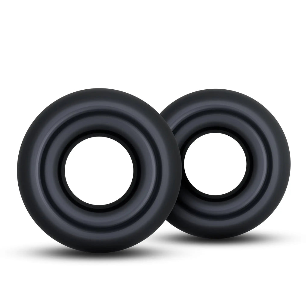 Black silicone stay hard donut rings oversized with concentric circular ridges for grip and comfort