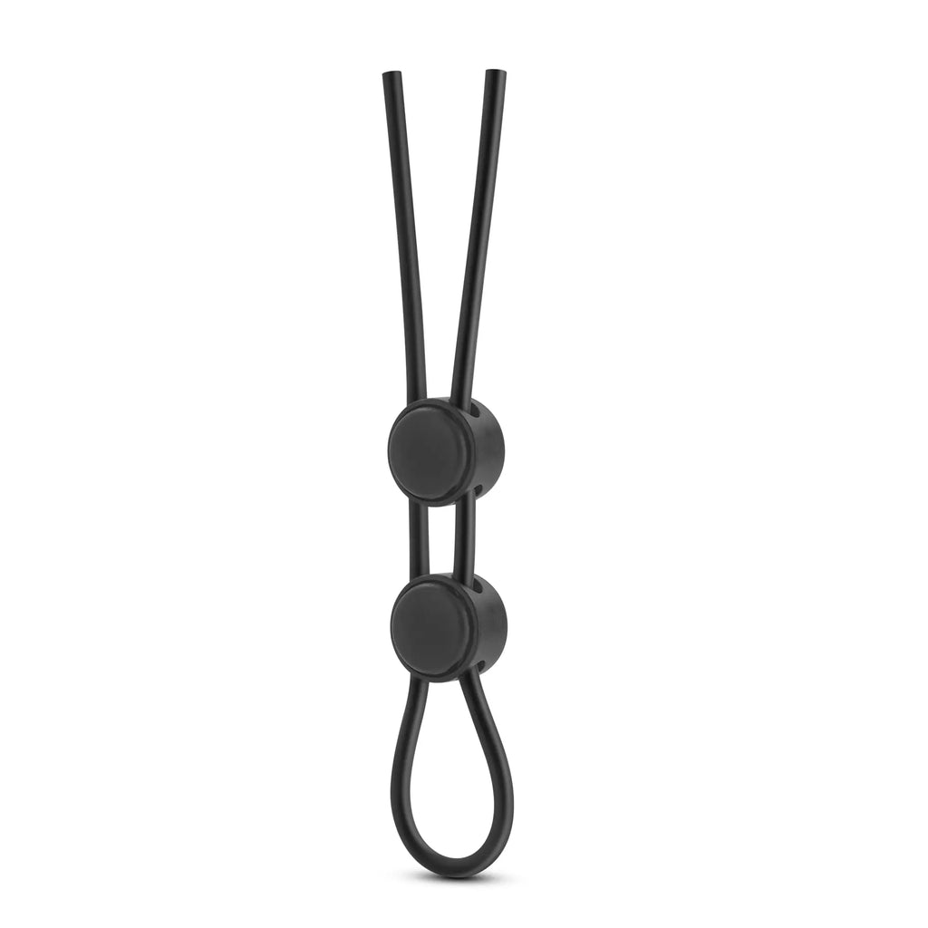 Black silicone double loop cock ring with two circular connectors and a looped end for stay hard support