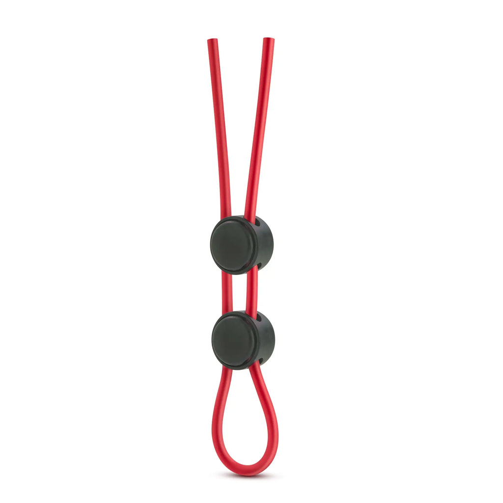 Red silicone double loop cock ring with two black circular clasps for enhanced fit and comfort