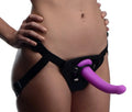 Purple silicone g-spot dildo in black harness shown from the back for hands-free pleasure and control