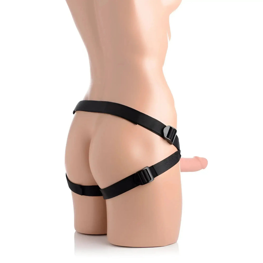 Black adjustable harness with plastic buckles for strap u seducer 7 inch silicone dildo flesh shown from back side