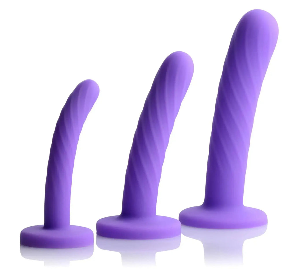 Set of three purple silicone vibrators with spiral texture and rounded bases from strap u tri-play dildo set