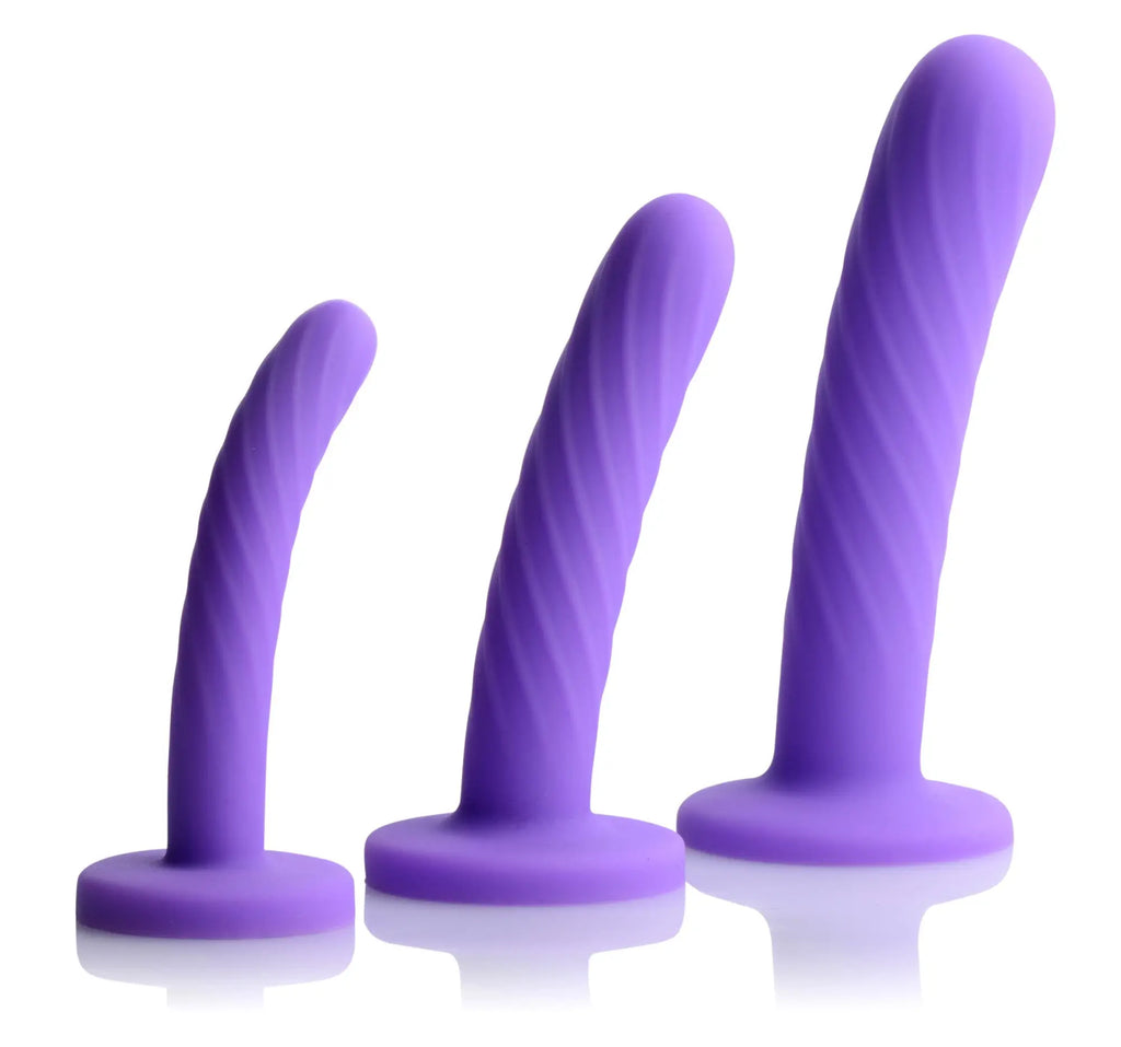 Set of three purple silicone vibrators with spiral texture and rounded bases from strap u tri-play dildo set