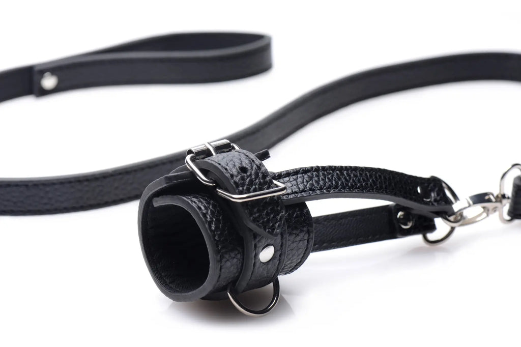 Black leather strict strict ball stretcher with textured surface silver buckle and chain leash for secure wear