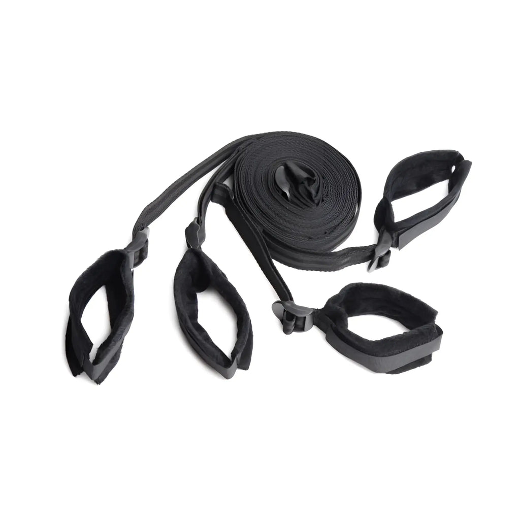 Black fabric bondage strap set with padded cuffs and adjustable buckles for strict bed restraint use