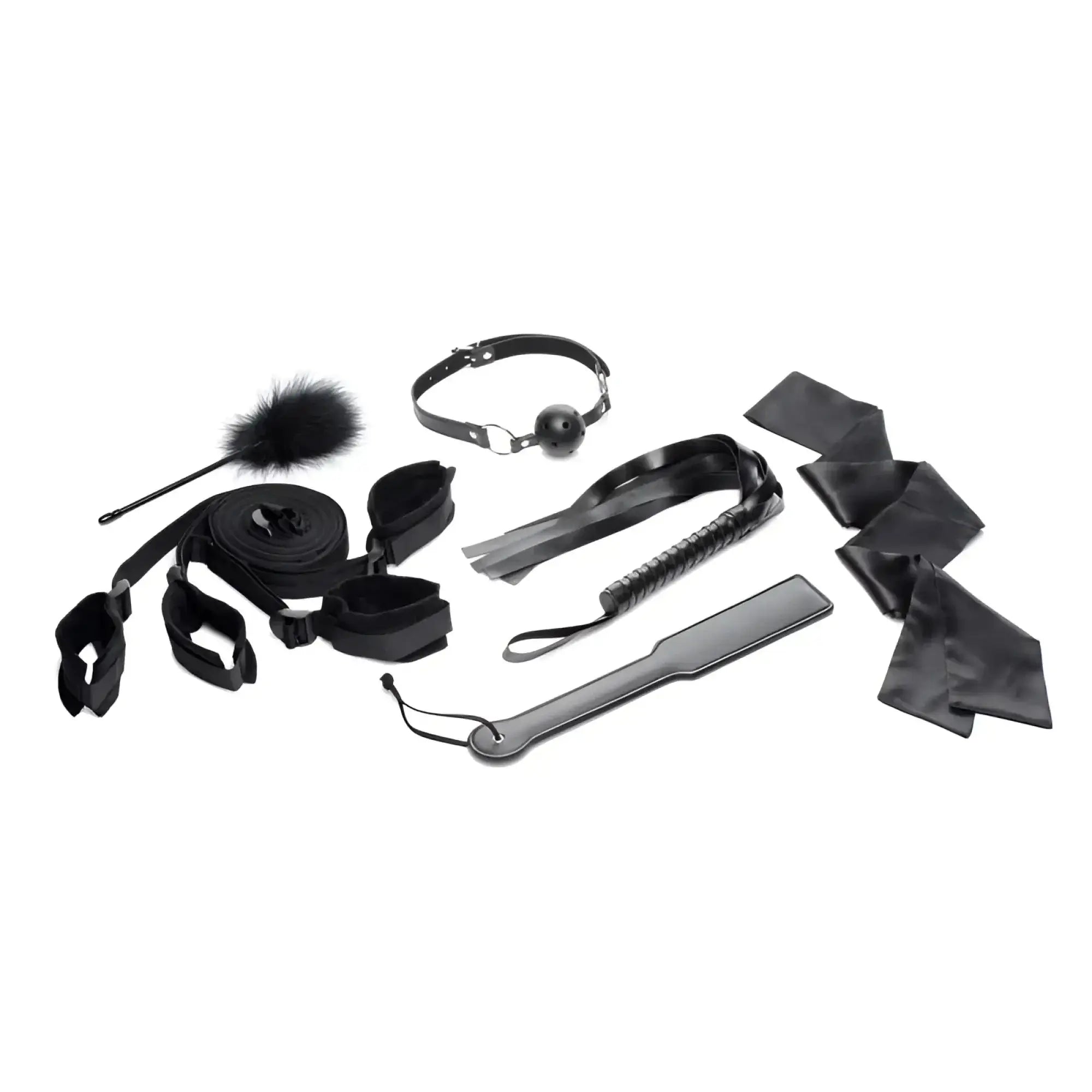 Black leather bondage kit with assorted restraints whip and accessories for strict bed restraint play