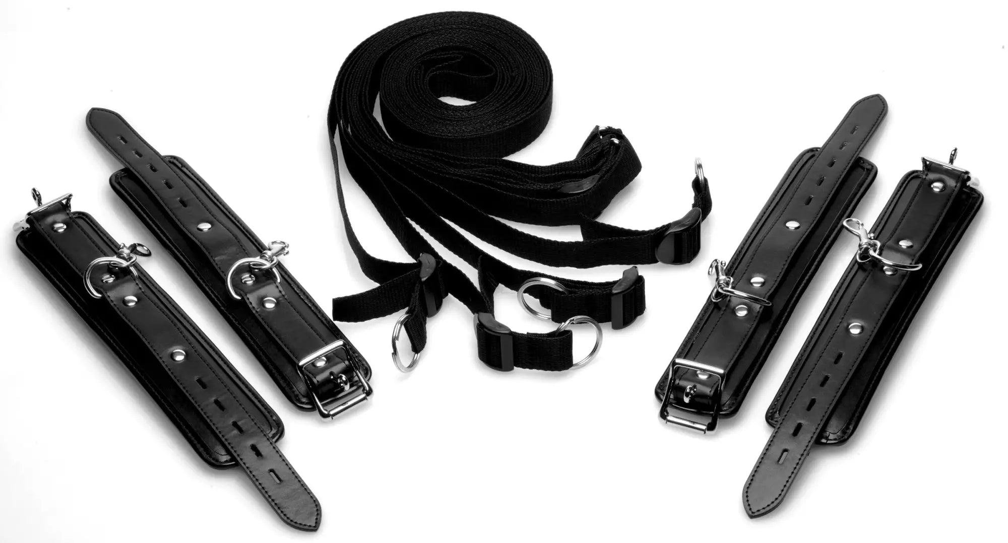 Black leather bondage restraint kit with metal hardware and adjustable straps for strict bed use