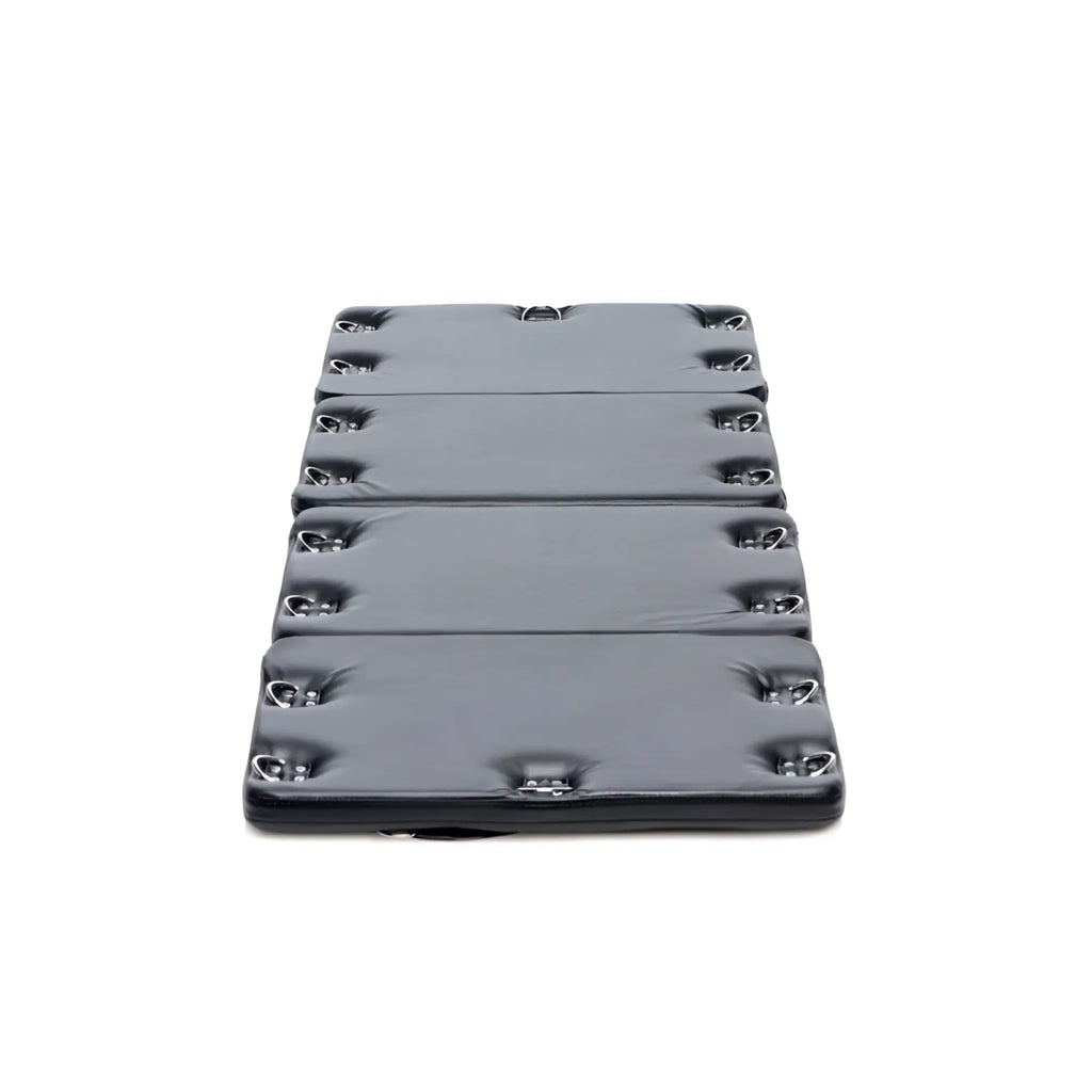Black padded folding mat with silver metal d rings along edges for strict bondage board black xl use