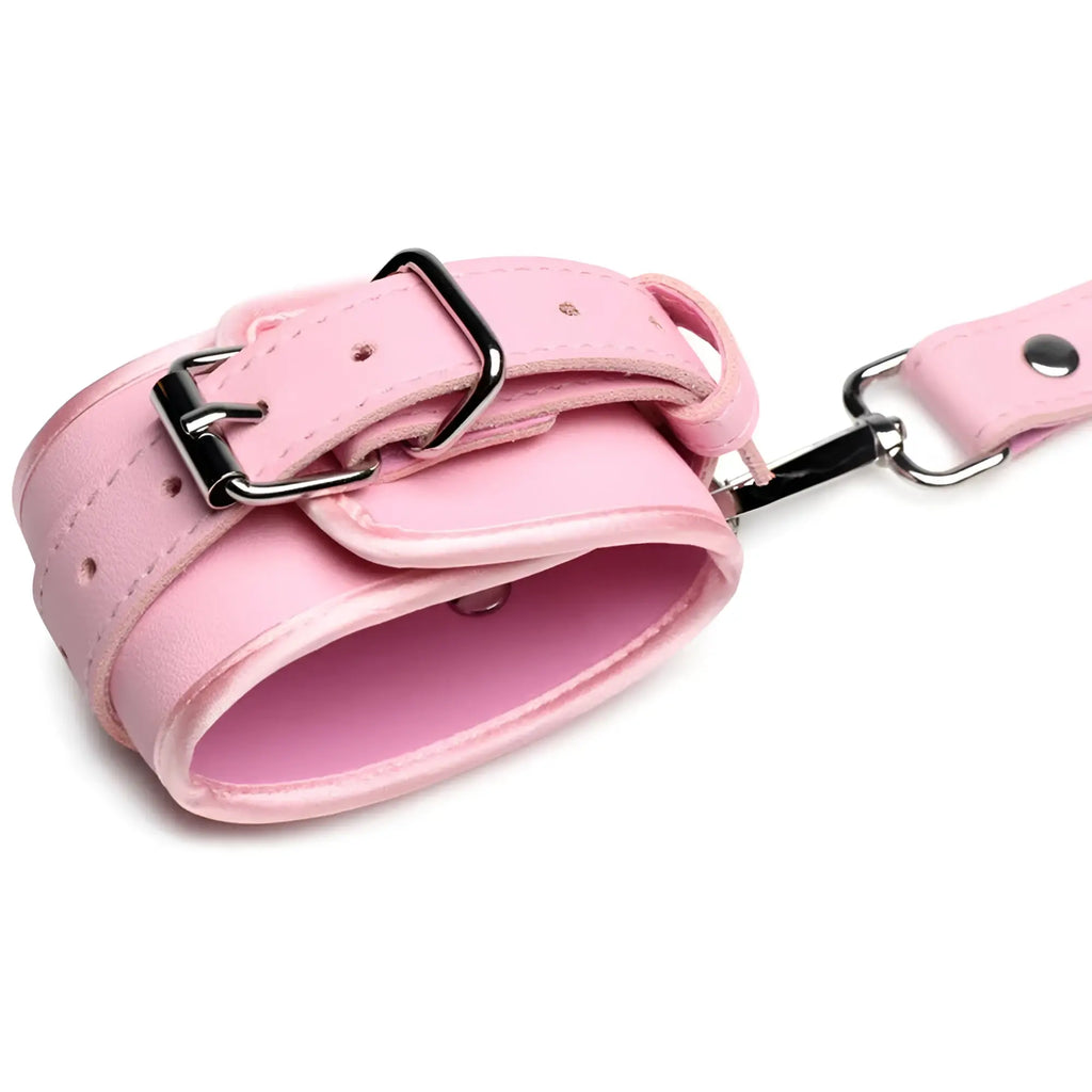 Pink leather strict bondage harness with black metal buckle and attached chain featuring decorative bows size m/l