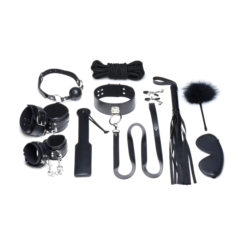 Black leather bondage set with metal hardware and a fluffy feathered whip end from strict deluxe 10 pc set