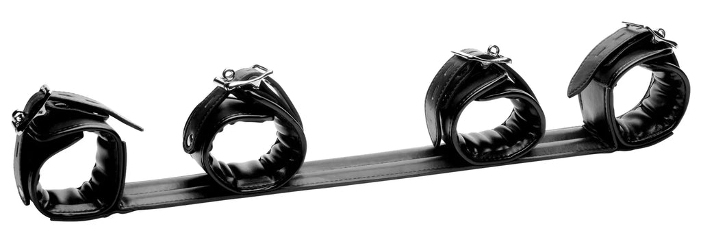 Black leather Strict Deluxe rigid spreader bar restraint set with four padded cuffs and central strap for bondage use