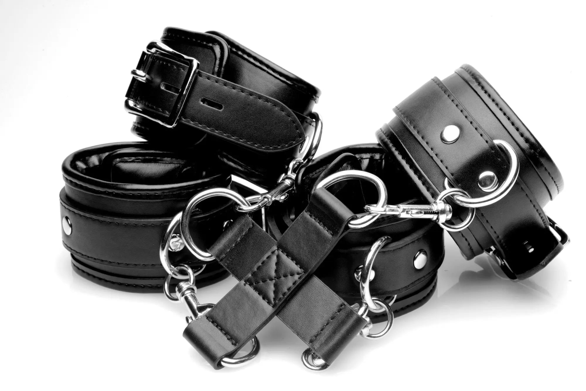 Black leather wrist cuffs with silver metal hardware and adjustable buckles for strict hogtie restraint use