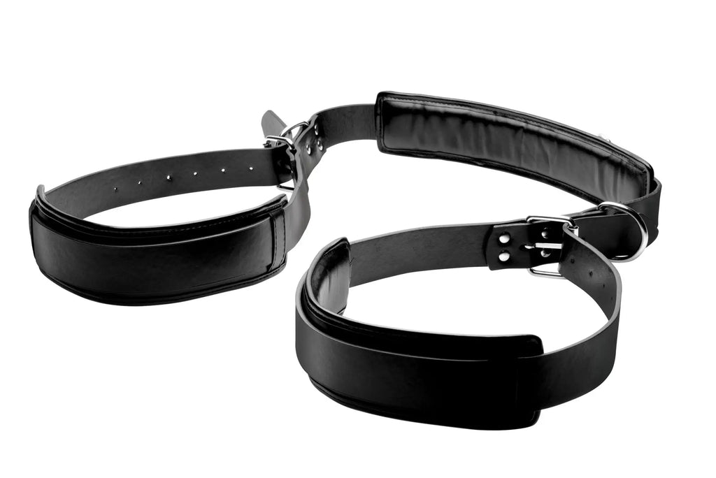 Black leather bondage harness with padded sections and metal buckles for strict padded thigh sling position aid