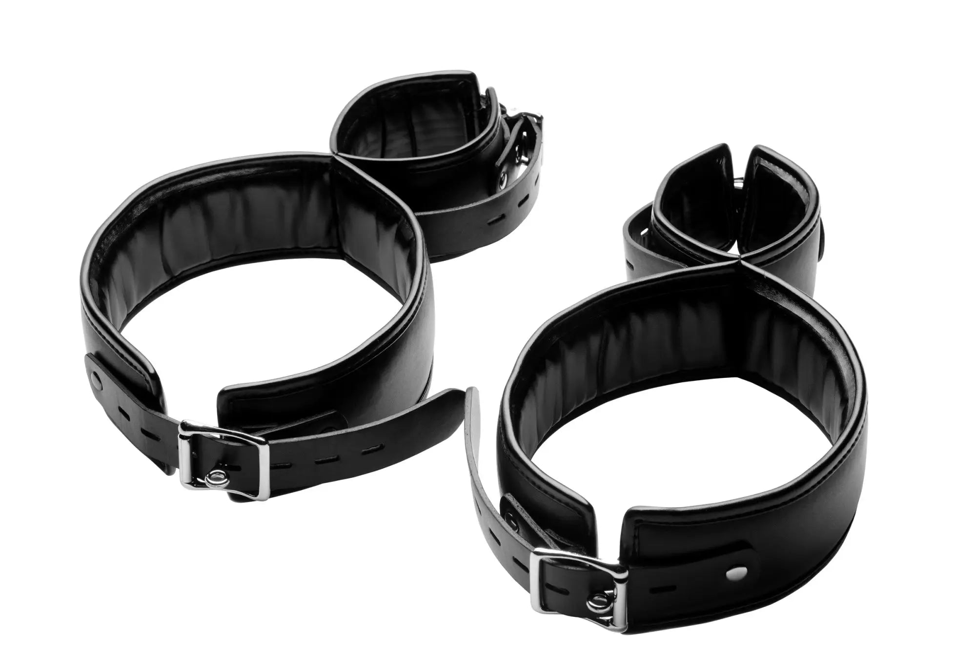 Black leather wrist and ankle cuffs with silver metal buckles from the strict thigh cuff restraint system