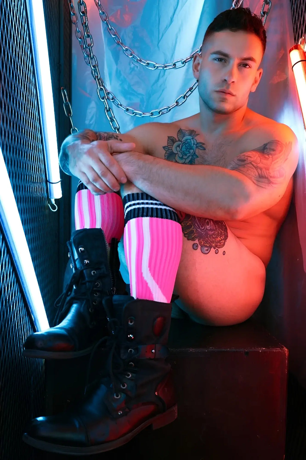 Black lace-up combat boots with red accents made of durable leather in sucker socks collection