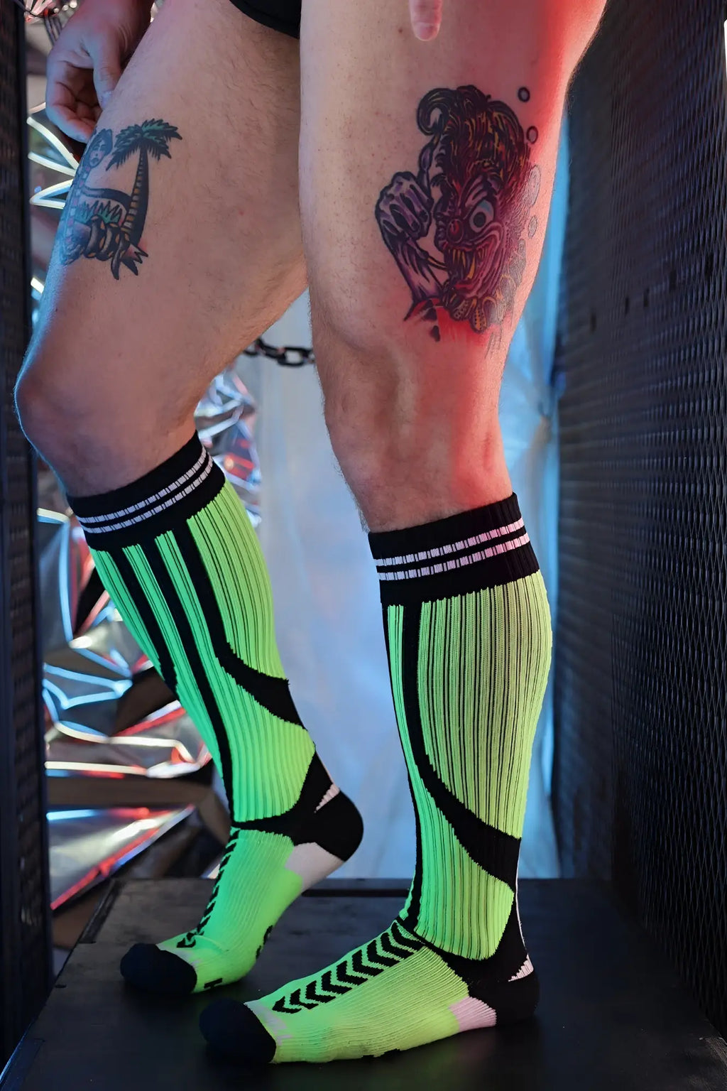 Sucker Socks neon green and black athletic compression socks with ribbed texture striped accents and reinforced toe and heel