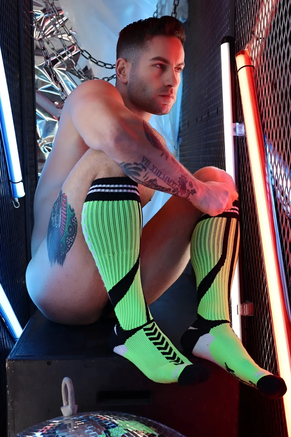 Neon green and black striped knee-high sucker socks with a textured ribbed knit design