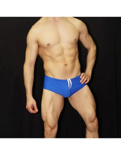 Arroyman men's blue sunga swimwear featuring a fitted design and drawstring waistband shown on a model.