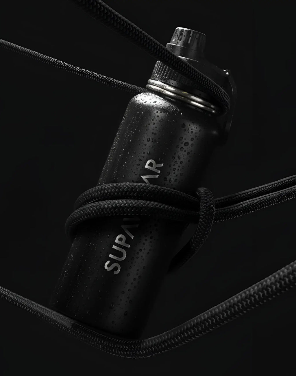 SupaWear 1L black stainless steel water bottle with silver screw-on cap and braided black cord wrapped around body