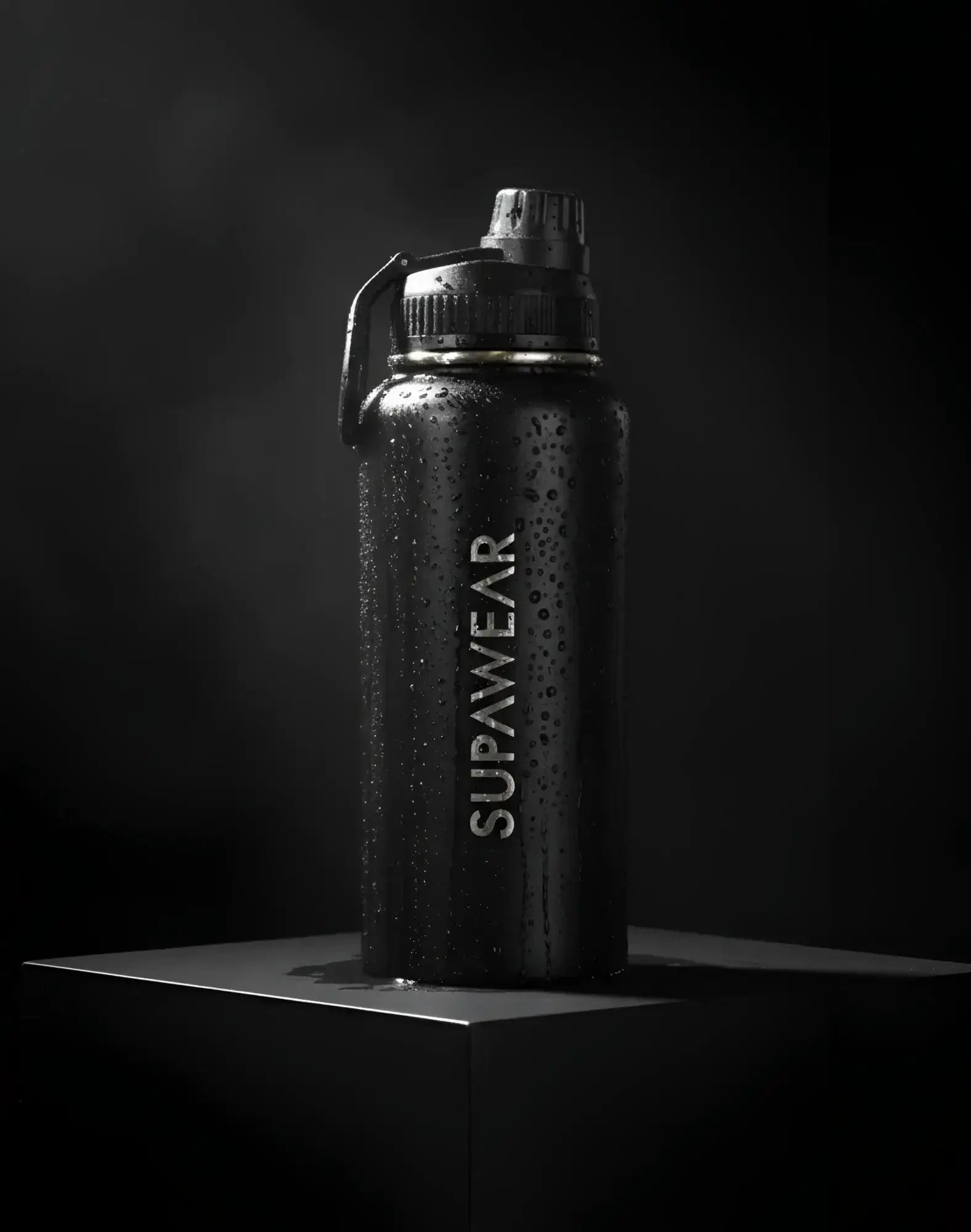 Black Supawear 1L water bottle with textured matte finish and silver logo for durable everyday hydration