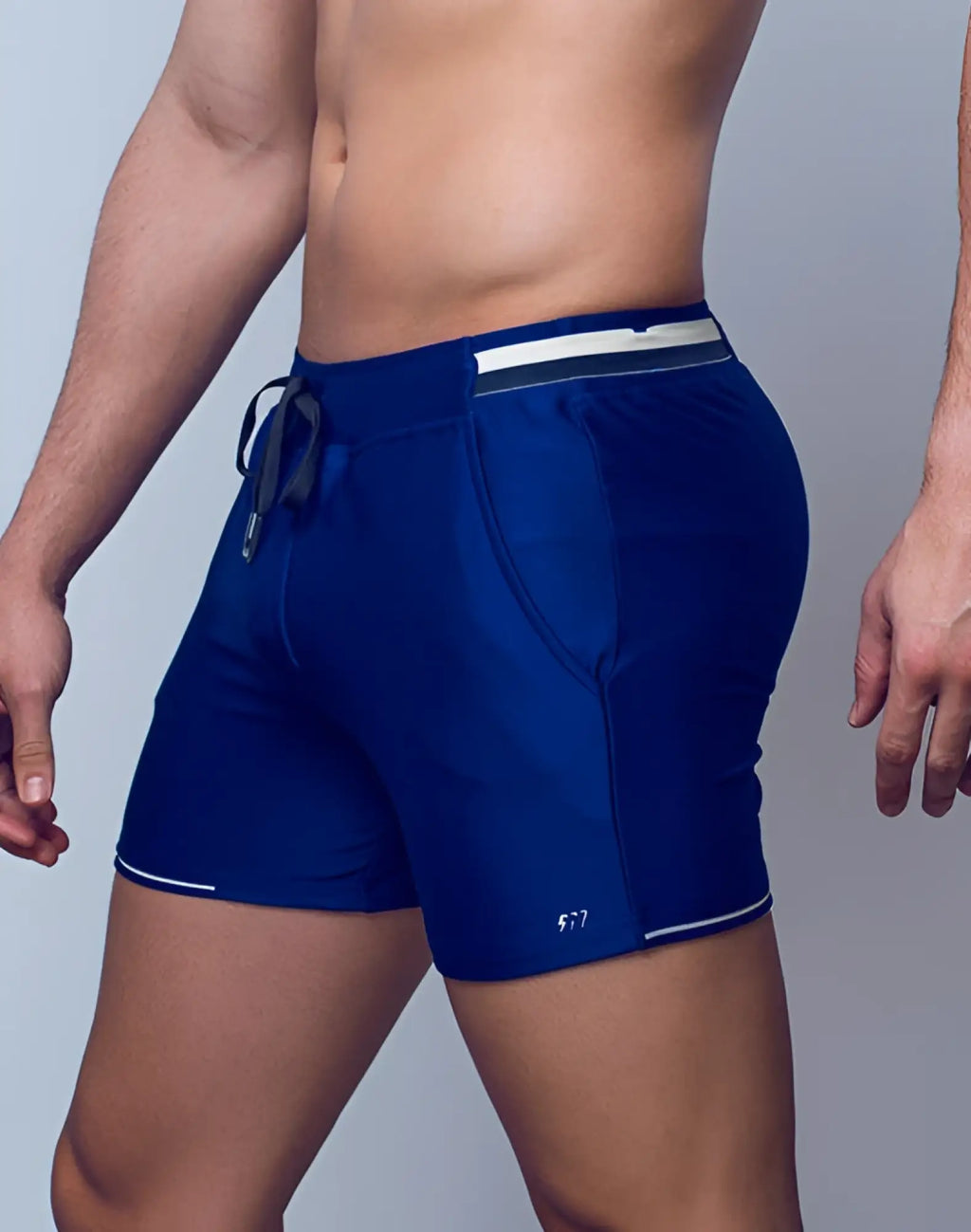Navy blue supawear 4 inch full lined mesh athletic shorts with white trim and drawstring waistband