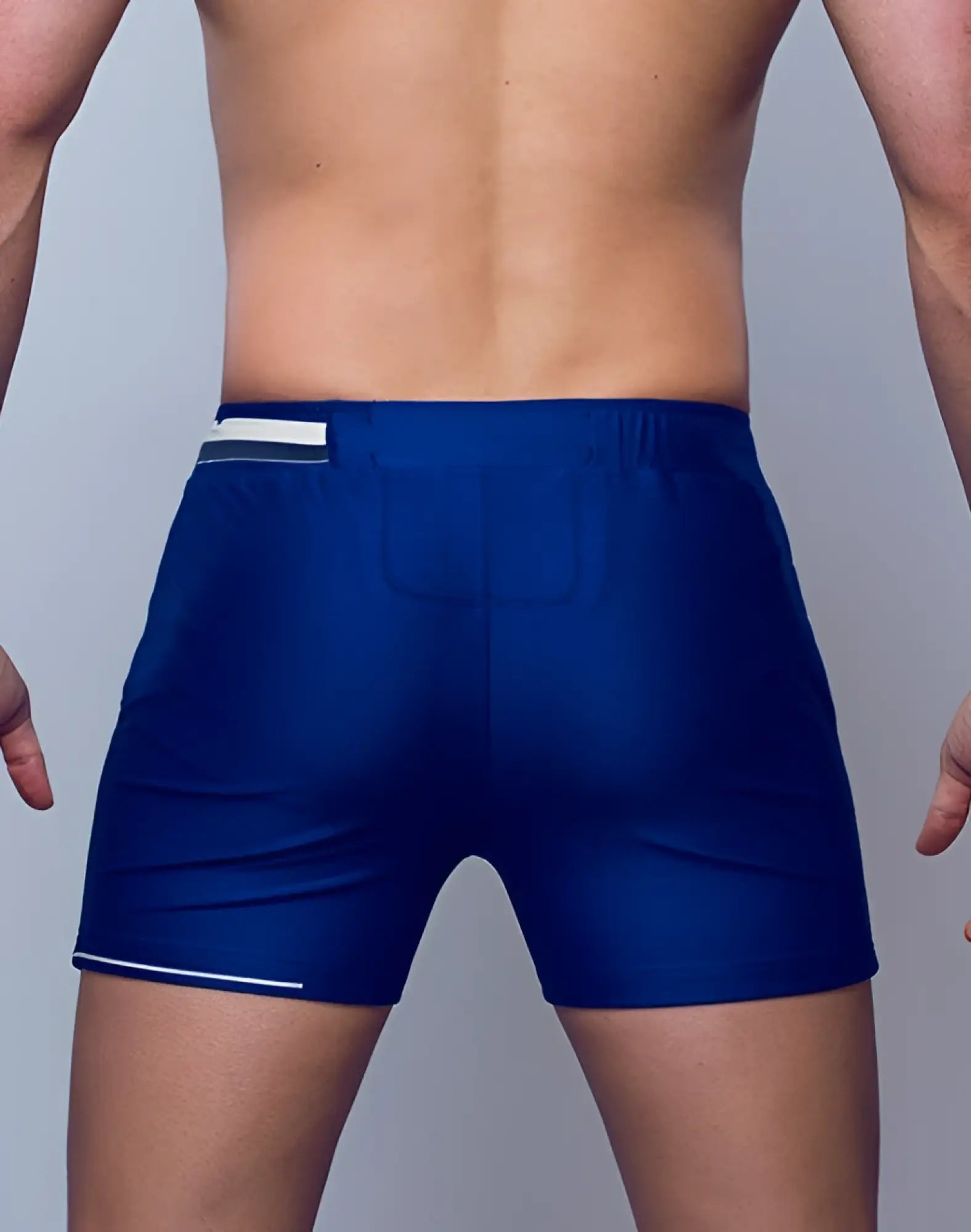 Navy blue supawear 4 inch full lined mesh athletic shorts with white trim along waistband and hem
