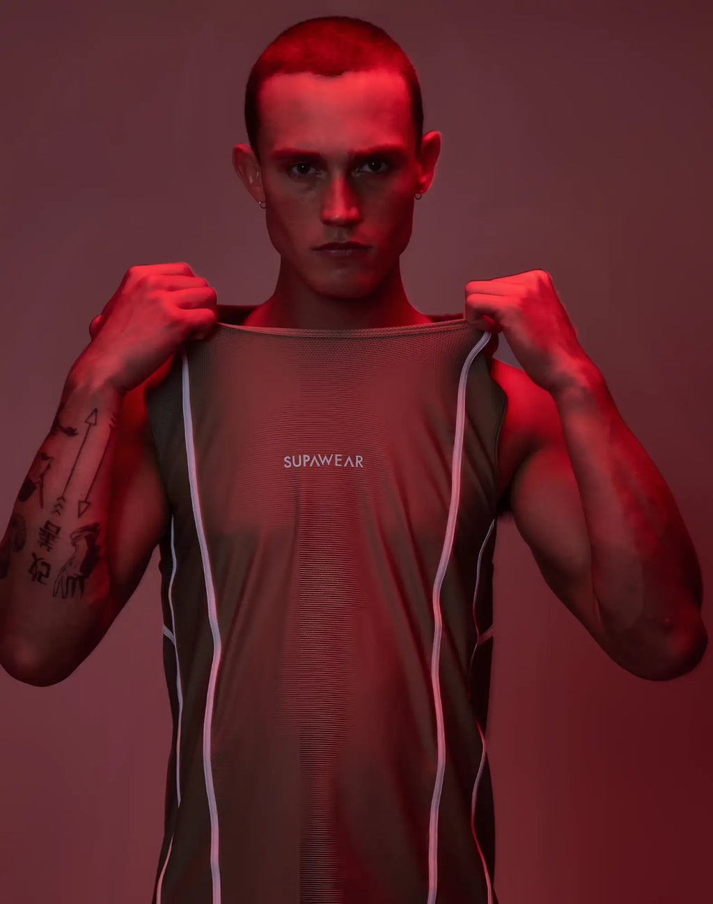 A sleek olive green sleeveless supawear airflow singlet with white vertical trim designed for athletic performance