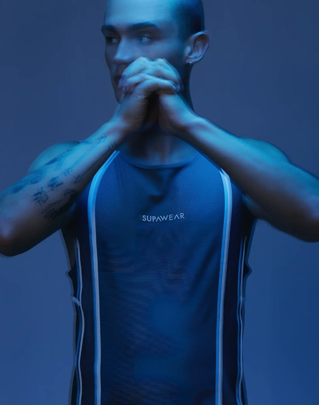 Dark blue supawear athletic tank top with white vertical stripes along the sides for active airflow performance