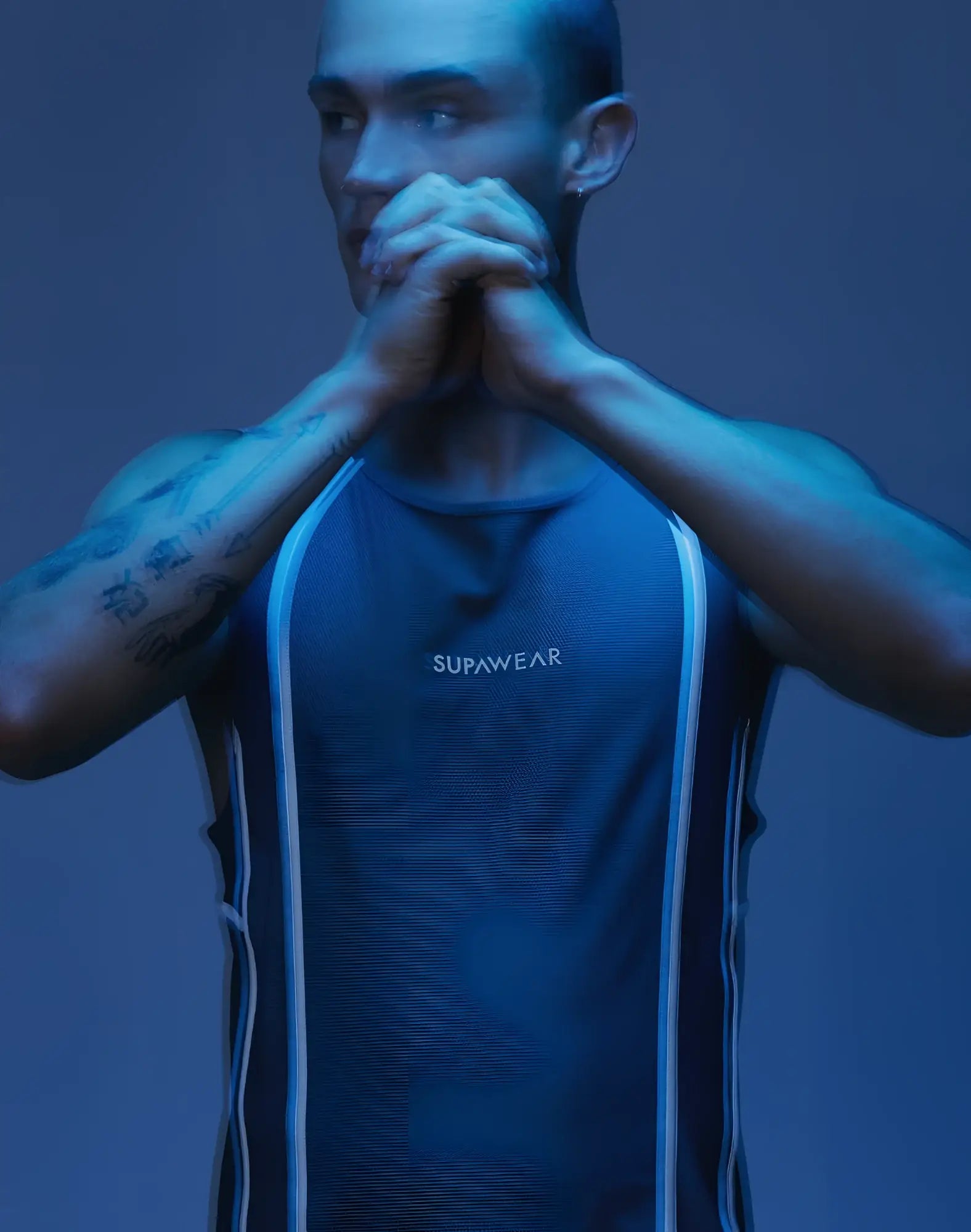 Dark blue supawear athletic tank top with white vertical stripes along the sides for active airflow performance