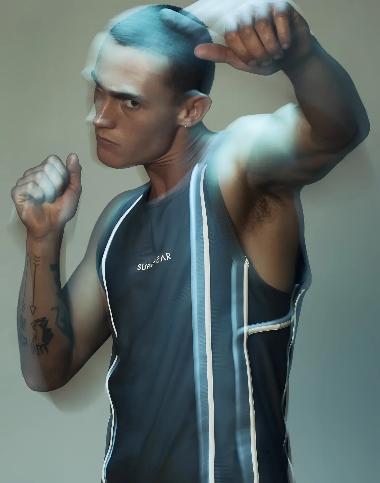 Dark gray sleeveless SUPAWEAR airflow singlet with white vertical stripes and Supreme branding on the chest