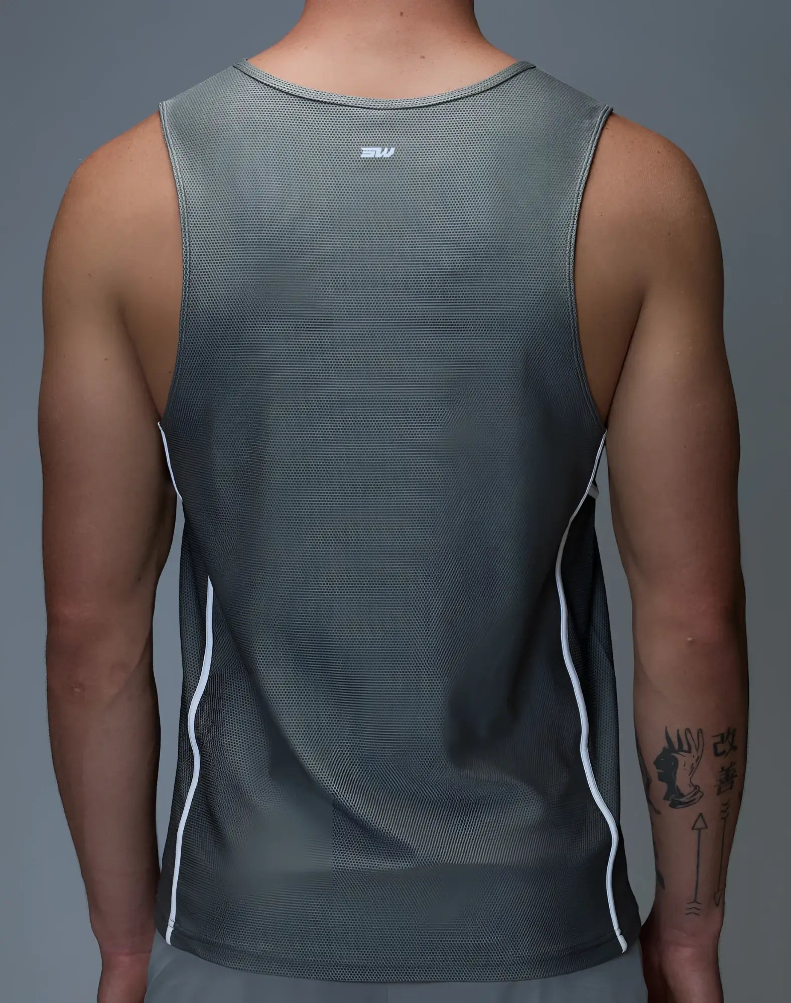 Gray SUPAWEAR airflow singlet athletic tank top with white side stripes and small logo at neckline