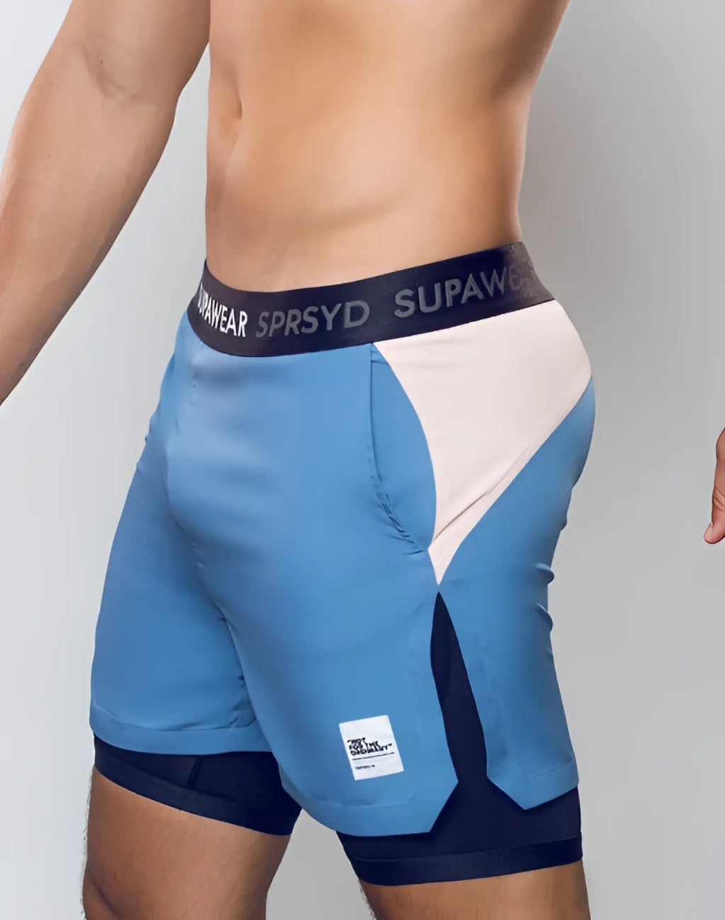 Blue and white supaw athletic shorts with black waistband featuring silver supaw logo and color blocked lined design