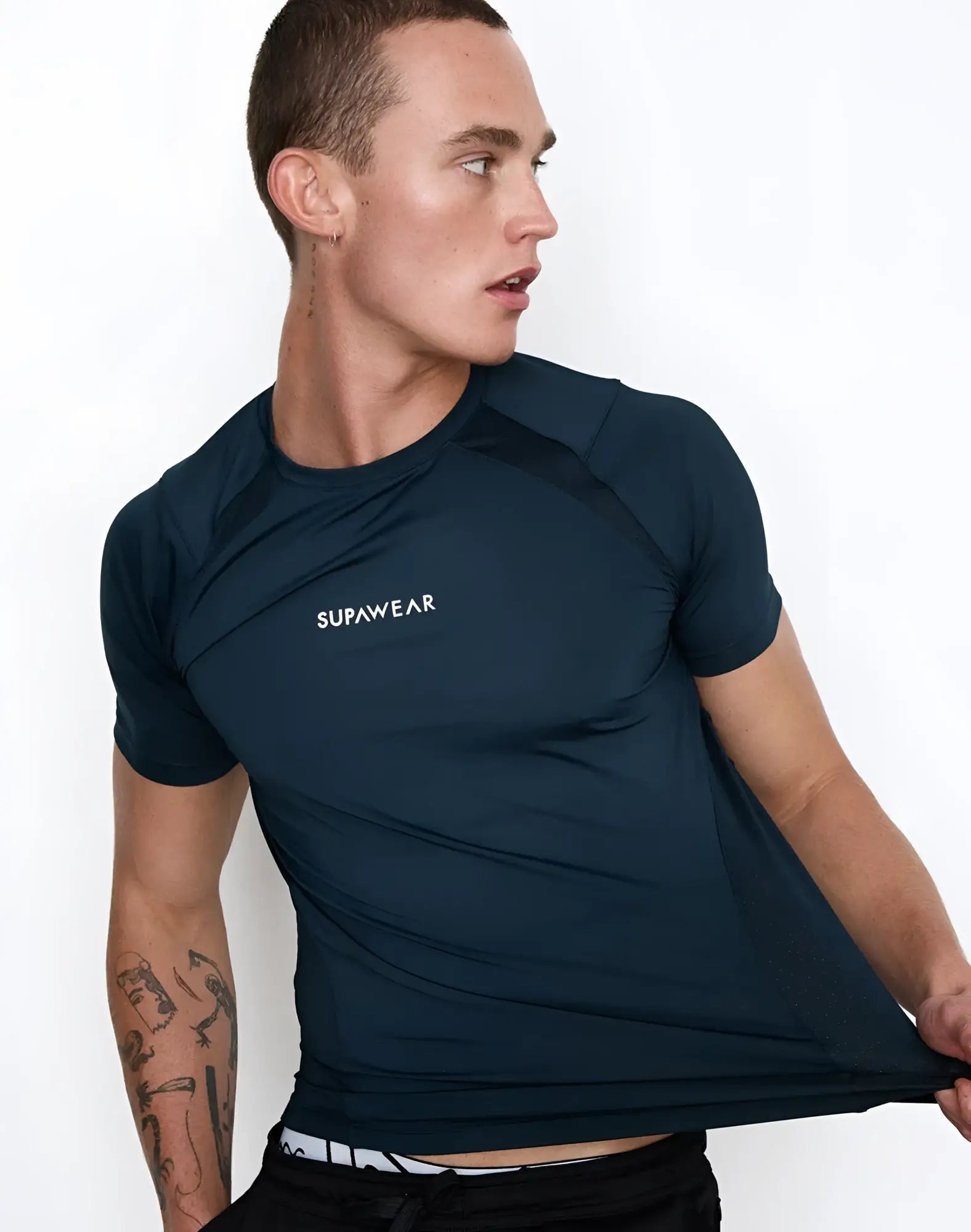 Dark navy supawear short sleeved athletic t-shirt with subtle white branding designed for contouring and performance