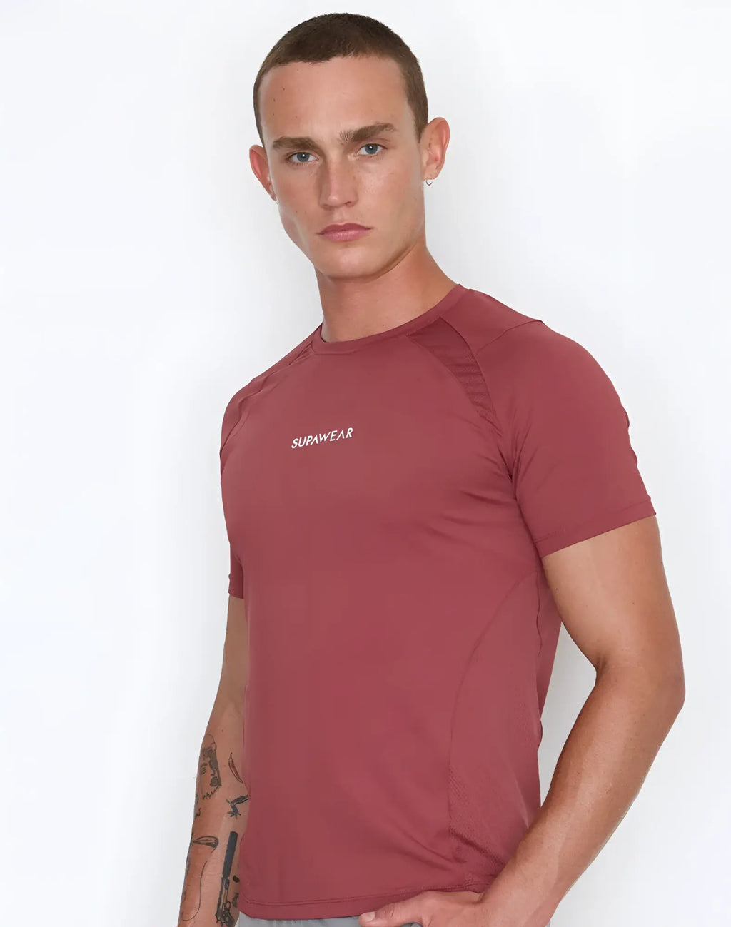 A maroon supawear contouring short-sleeved athletic t-shirt with a subtle white logo on the chest